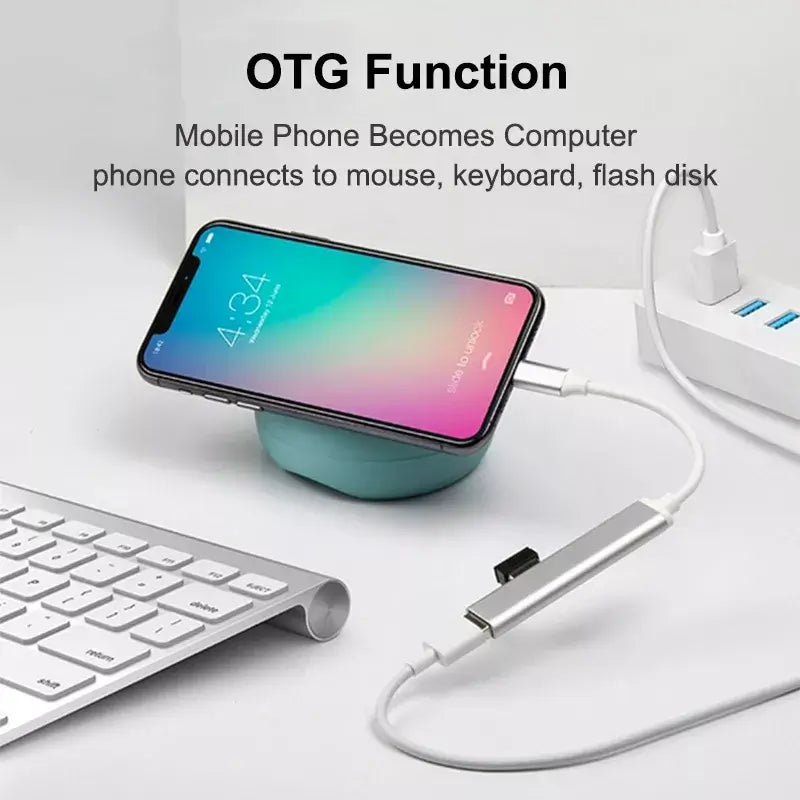 Phone with OTG adapter connected to a keyboard and flash drive on a white background
