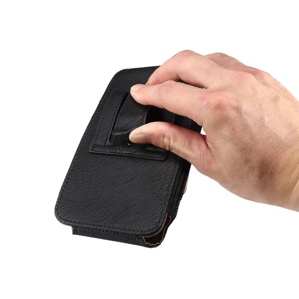 Hand opening a black leather wallet on a white background