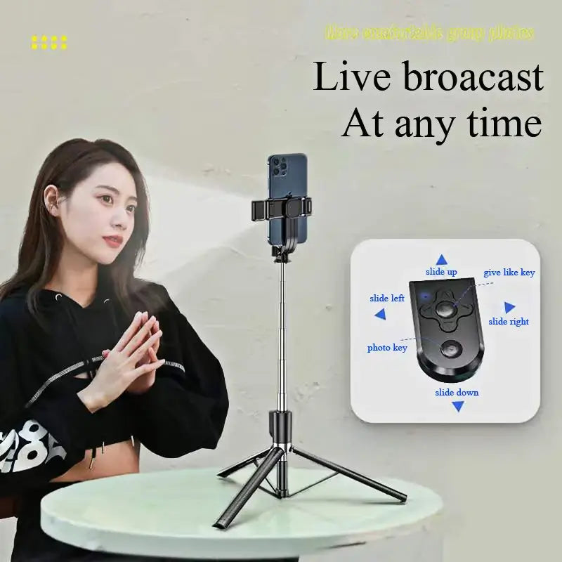Woman using a smartphone with a selfie stick and control panel for live broadcasting.