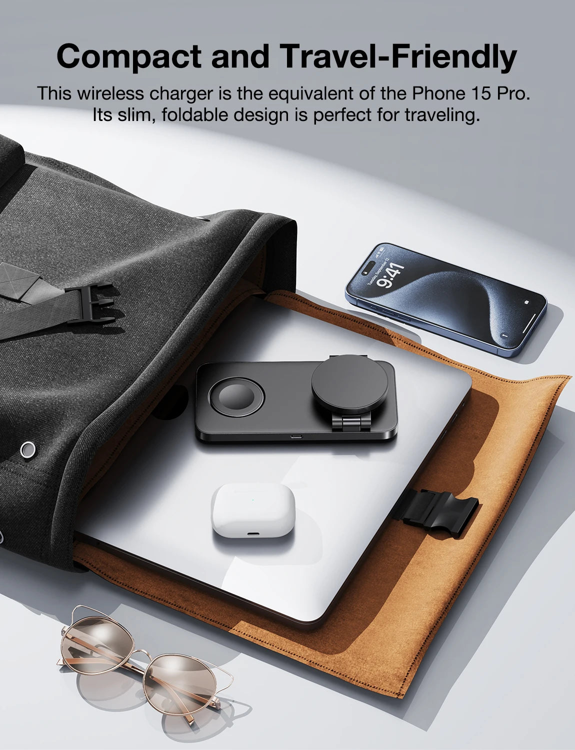 Wireless charger with phone and accessories on a light surface