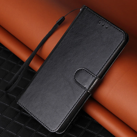 Black phone case with a strap on a brown surface