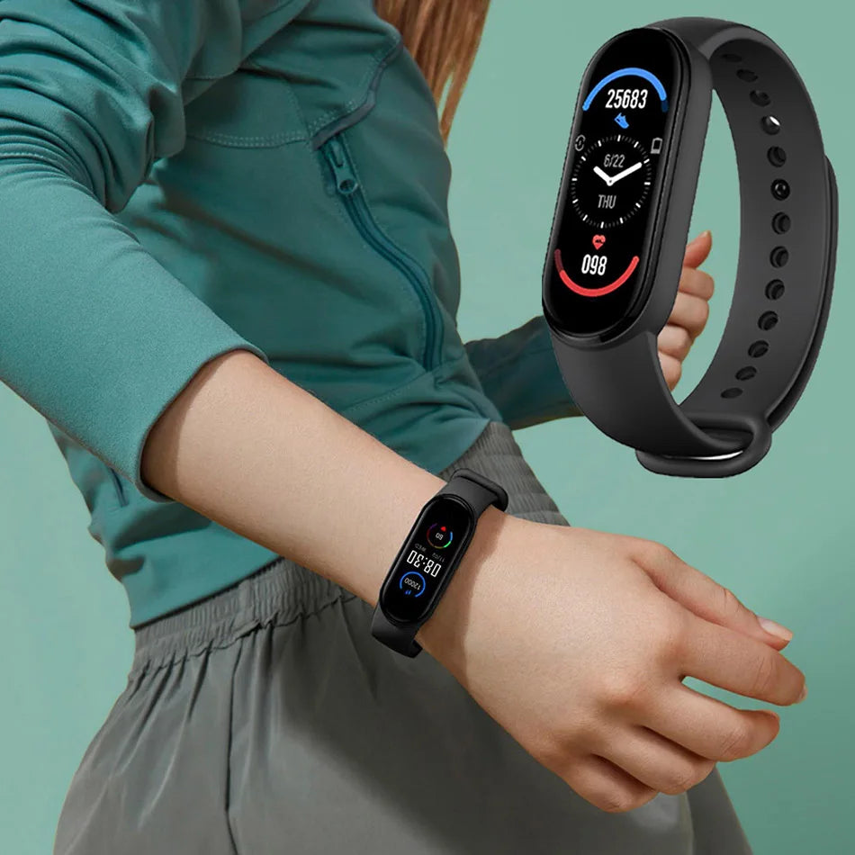 Person wearing a smartwatch with a close-up of the watch face on a teal background
