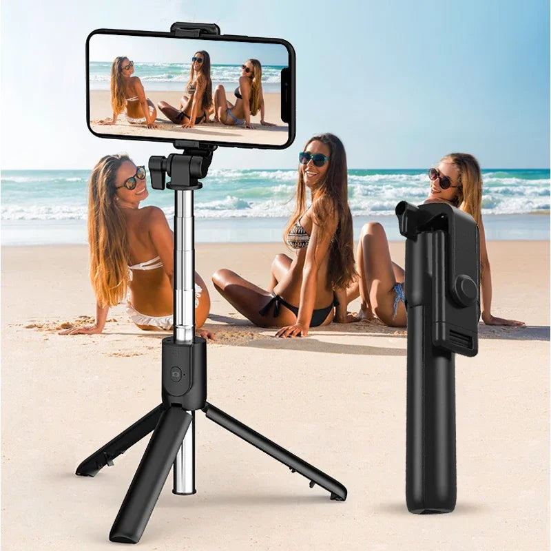 Phone holder with tripod on a beach with women taking a selfie.