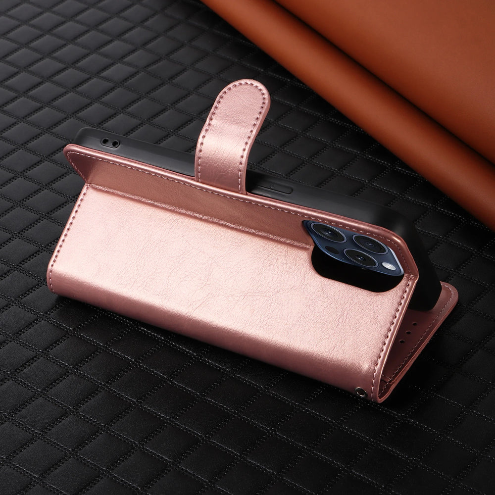Rose gold phone case with a phone inside on a black textured surface