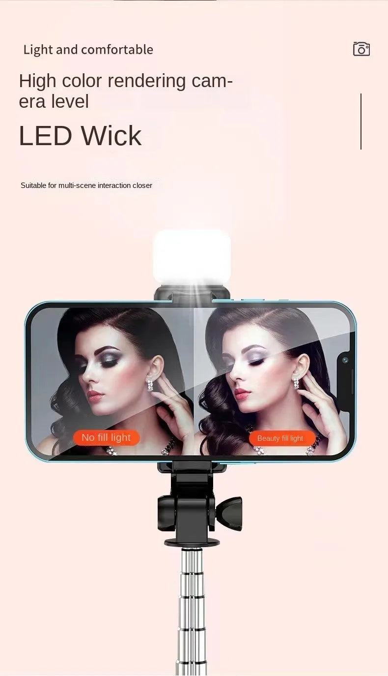 Smartphone with a selfie stick displaying a woman's face on a pink background with text about LED wick.