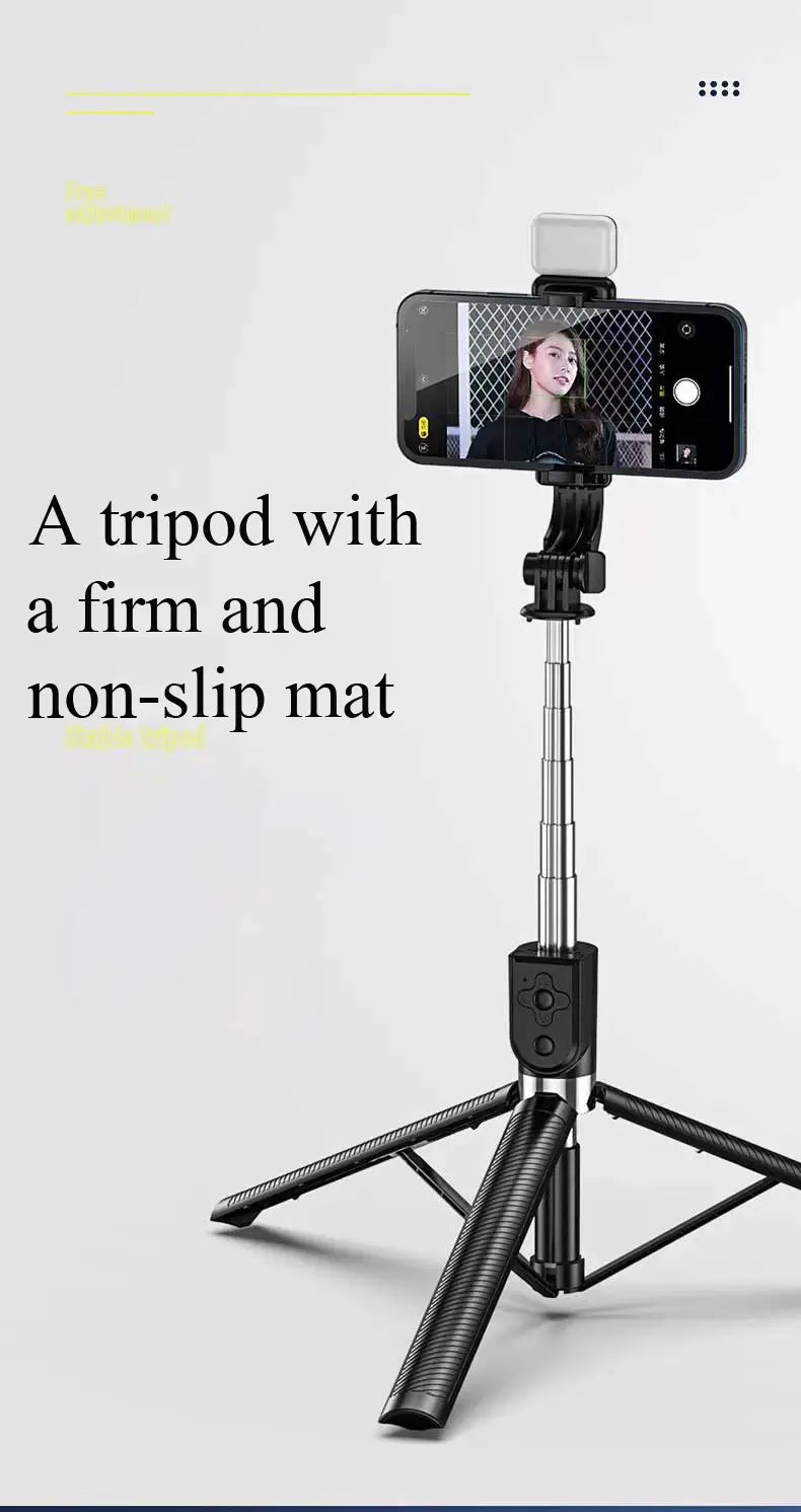 Black tripod with smartphone holder on a light gray background