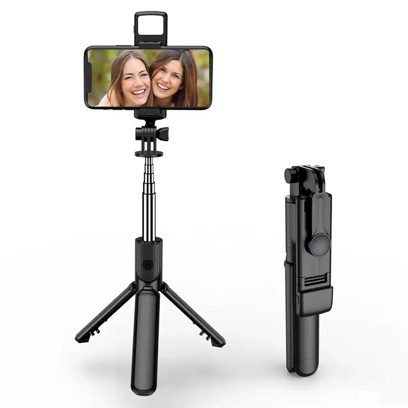 Wireless black selfie stick with smartphone holder on a white background