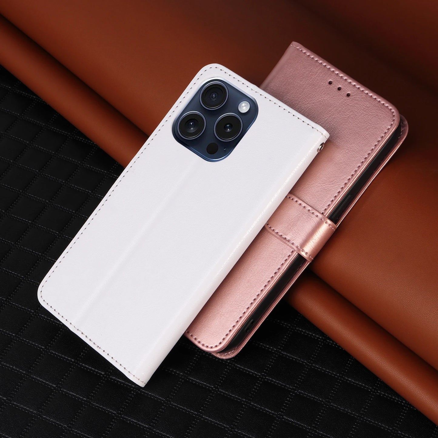 White and rose gold phone cases on a dark textured surface