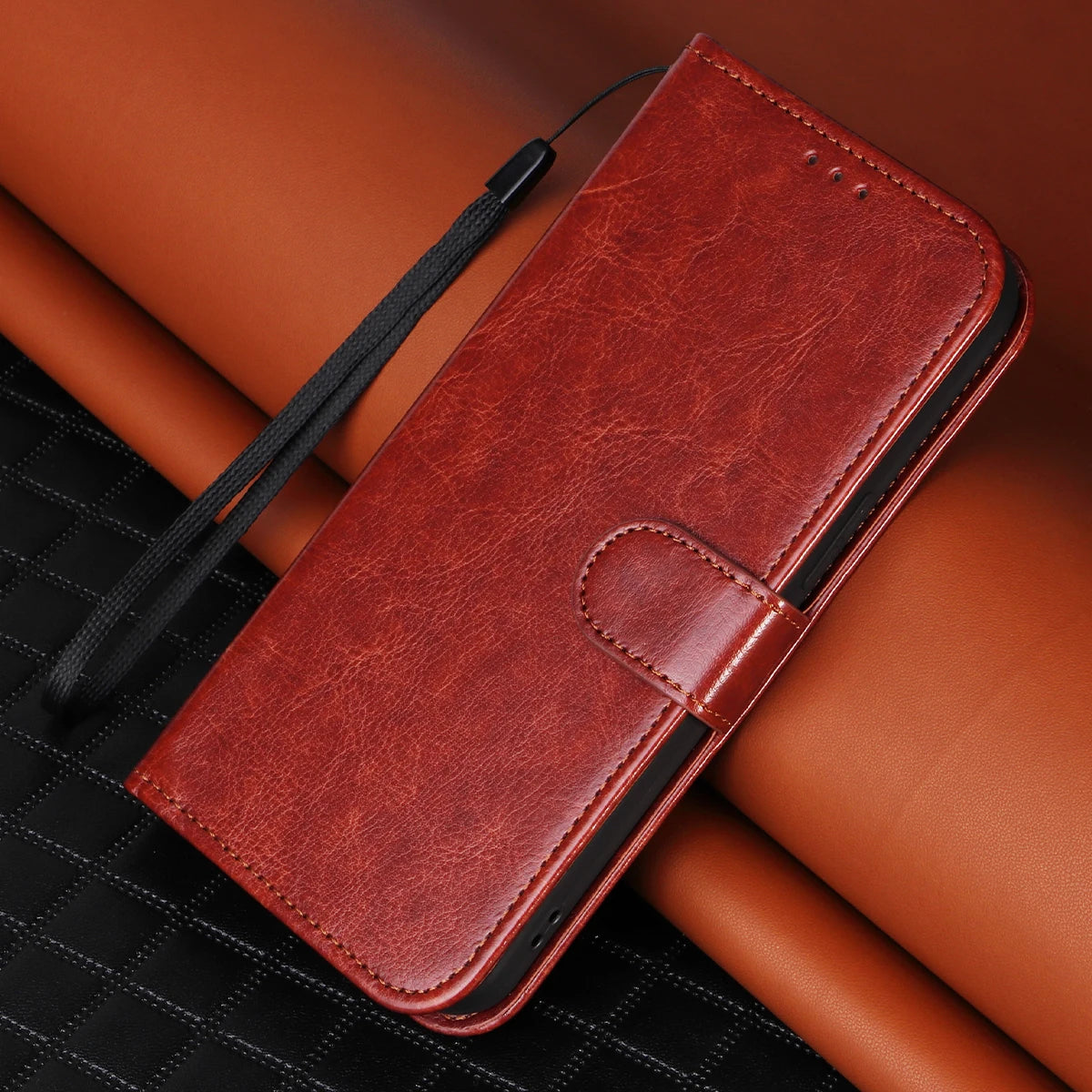Brown leather phone case on a brown surface