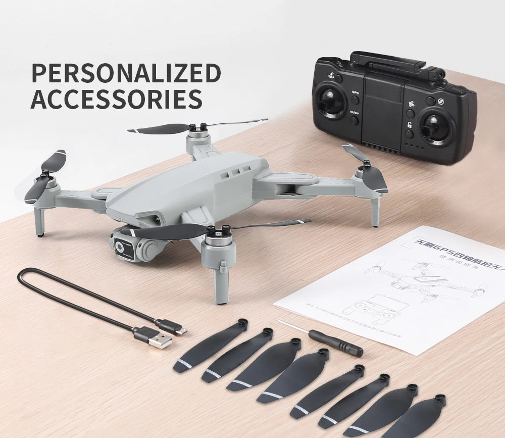 Drone with accessories on a wooden surface, including remote control and propellers.