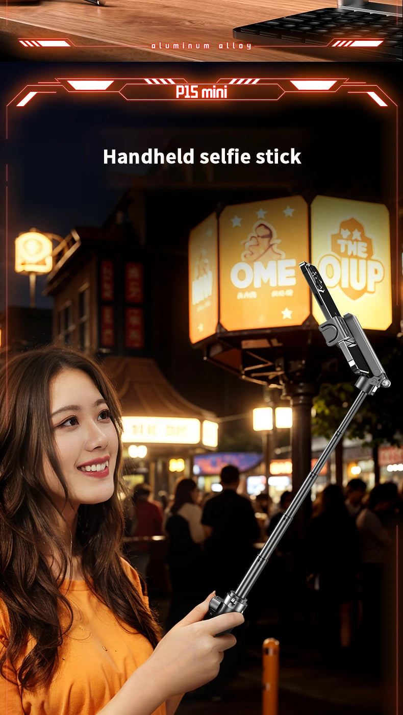 Handheld selfie stick held by a person in an urban night setting with a visible brand logo.