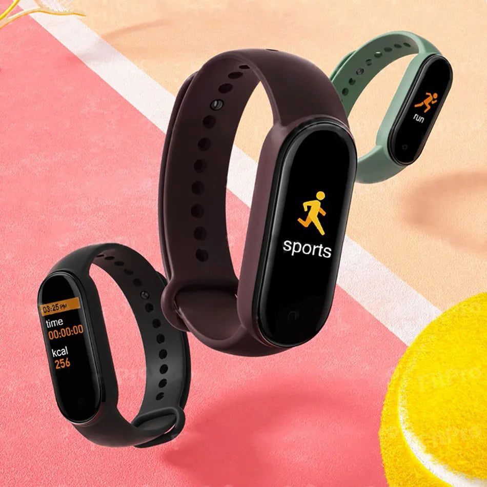 Three fitness trackers on a colorful background