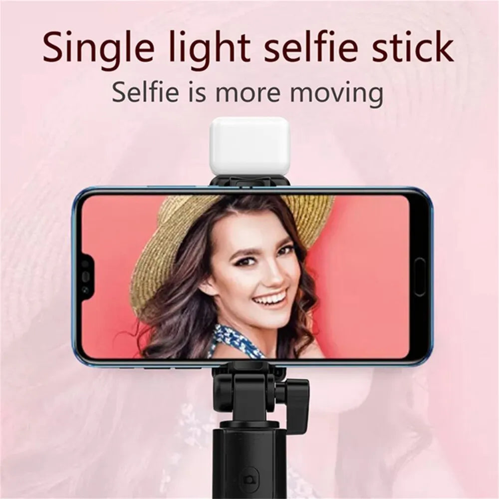 Smartphone with a selfie light and stand on a pink background
