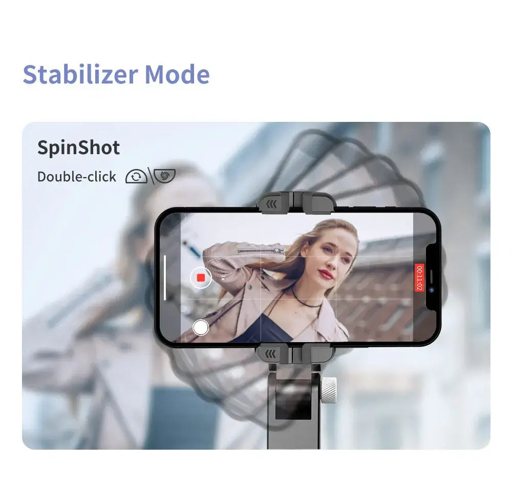 Smartphone displaying SpinShot app interface while mounted on a stabilizer device in handheld mode for smooth video capture