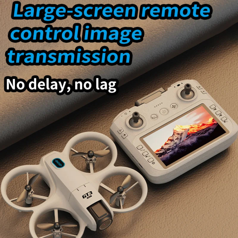 Drone with remote control and screen displaying mountain landscape on a brown surface.