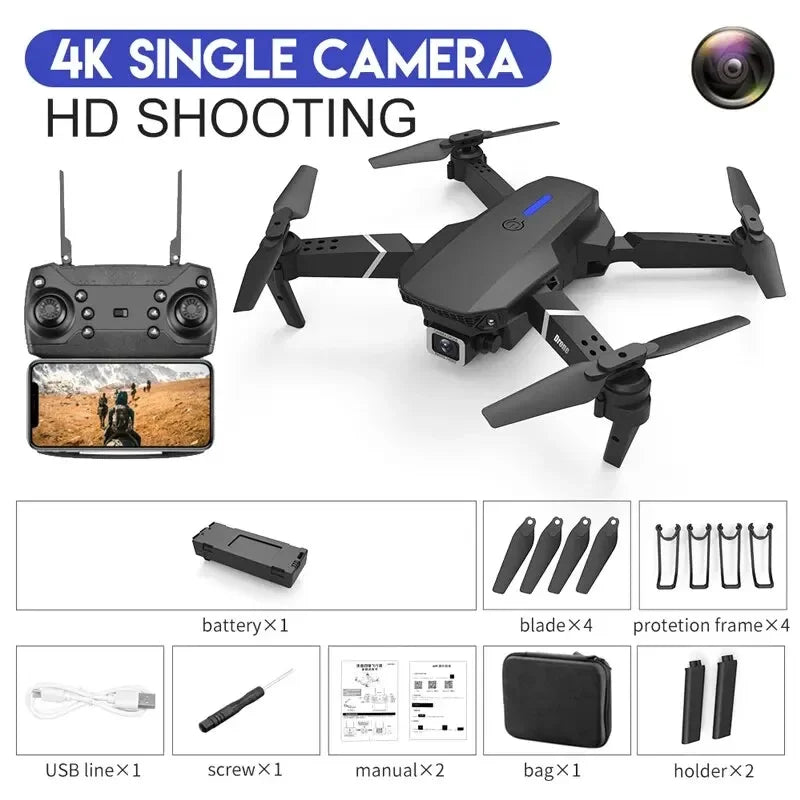 Black drone with remote control, camera, and accessories on a white background