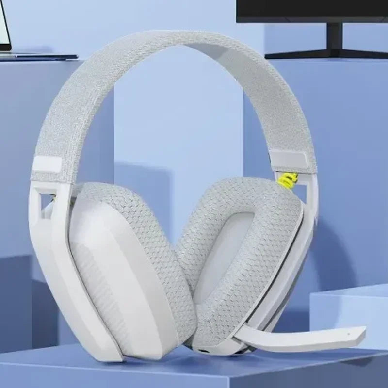 White gaming headset on a blue surface with a blurred background