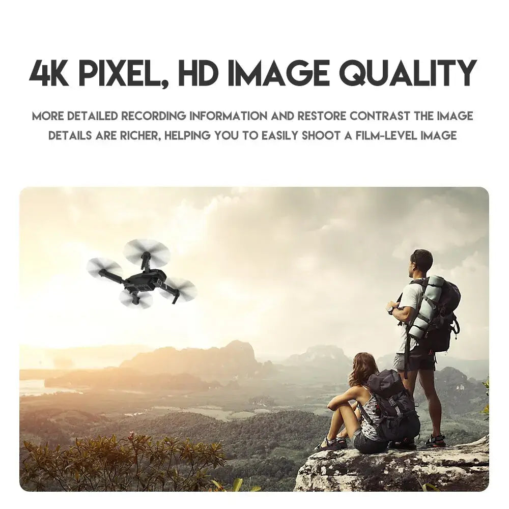 Two people with backpacks overlooking a scenic landscape with an E88 Pro drone flying above