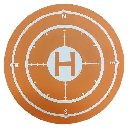 Circular target with concentric rings and a central 'H' on an orange background