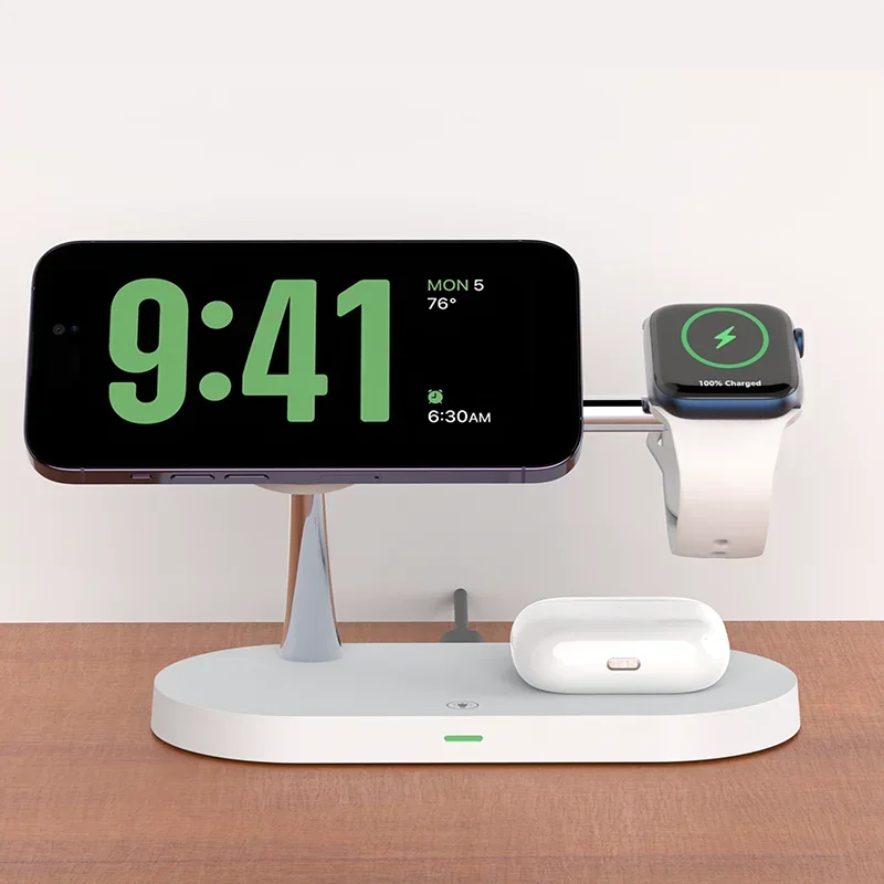 Multi-device charging station with smartphone, smartwatch, and wireless earbuds on a wooden surface.