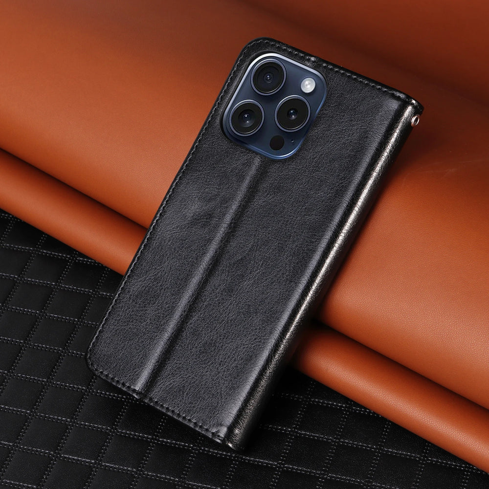 Black phone case on a brown leather surface