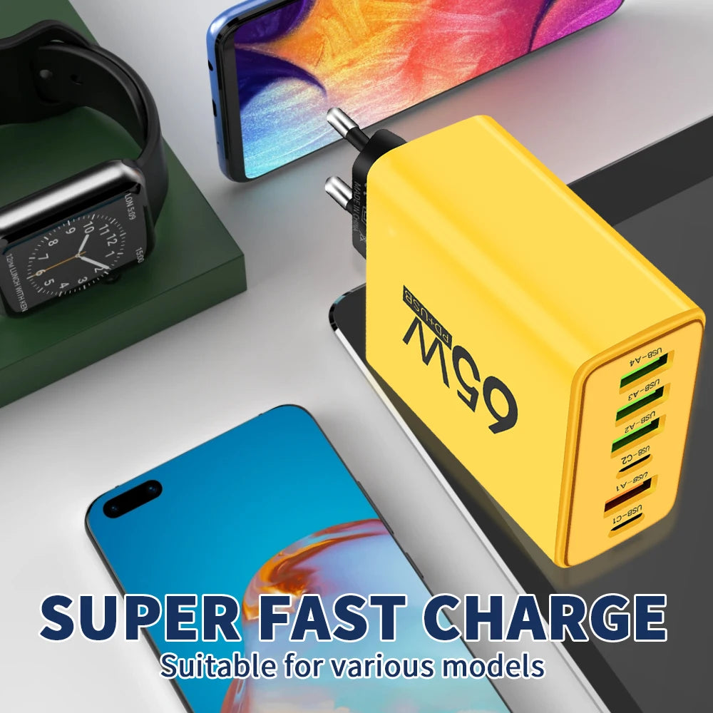 Yellow power adapter with multiple USB ports on a white surface, surrounded by electronic devices.