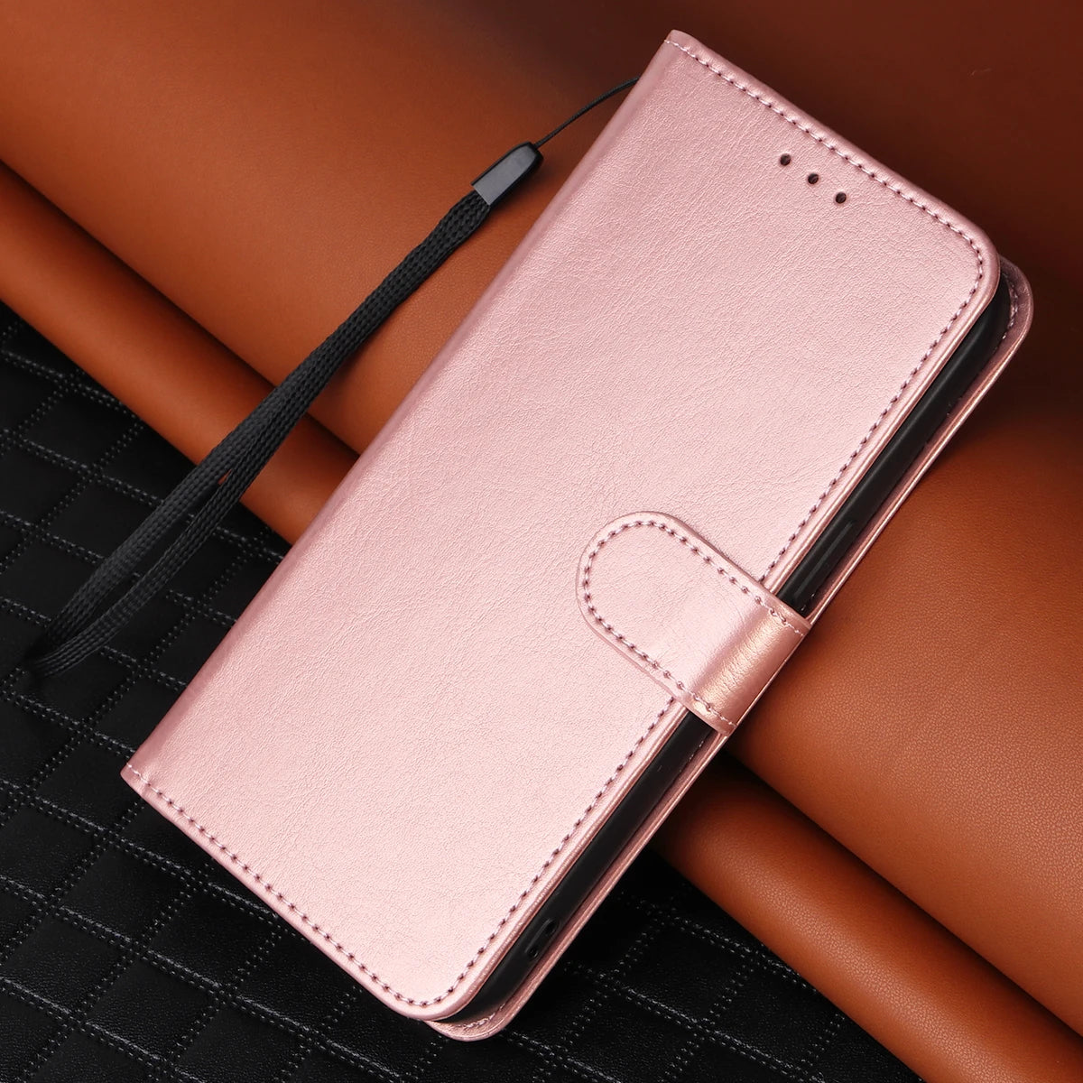 Rose gold phone case on a brown surface