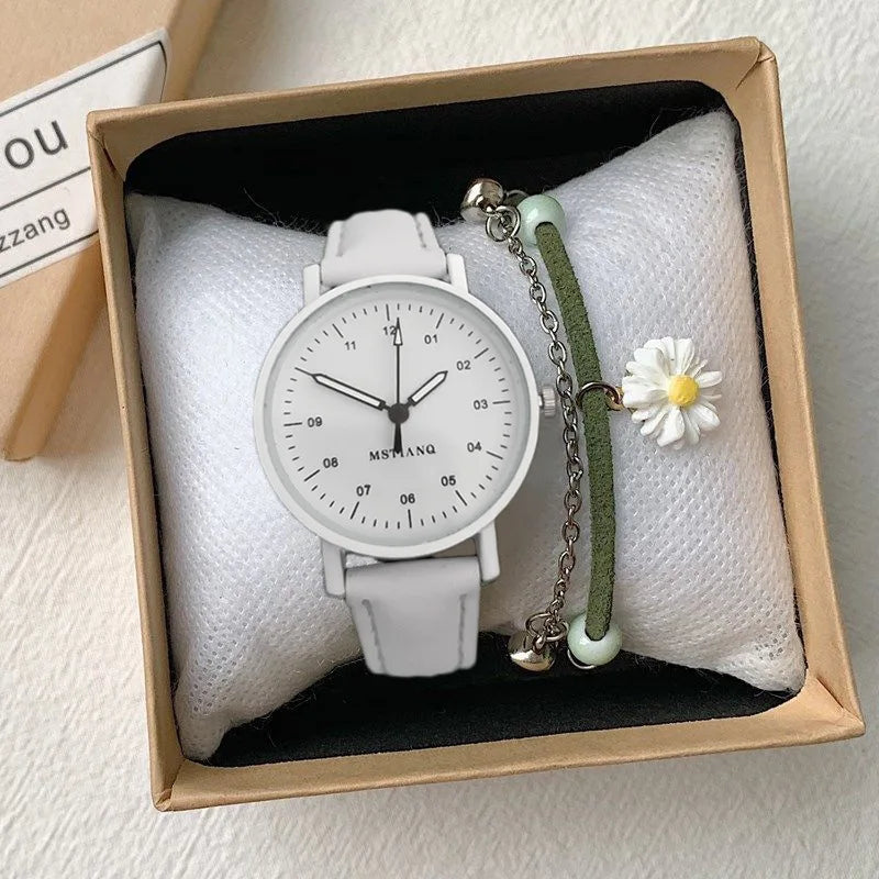 White MSTIANQ wristwatch with matching daisy bracelet in a gift box on a white background