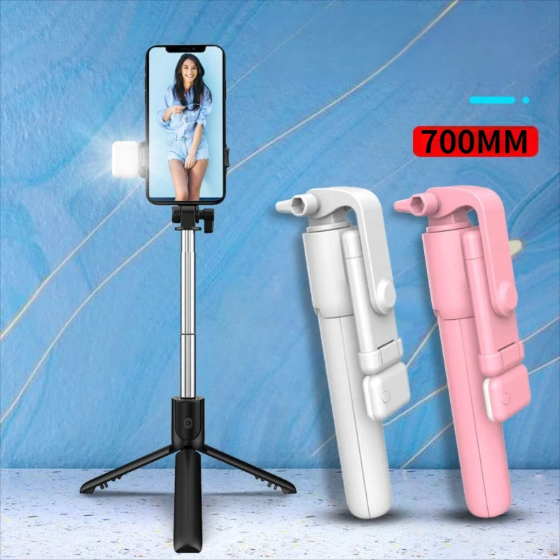 Selfie stick with smartphone holder, two additional extenders, and a blue background.