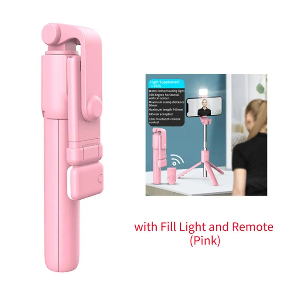 Pink phone selfie stick with fill light and remote on a white background
