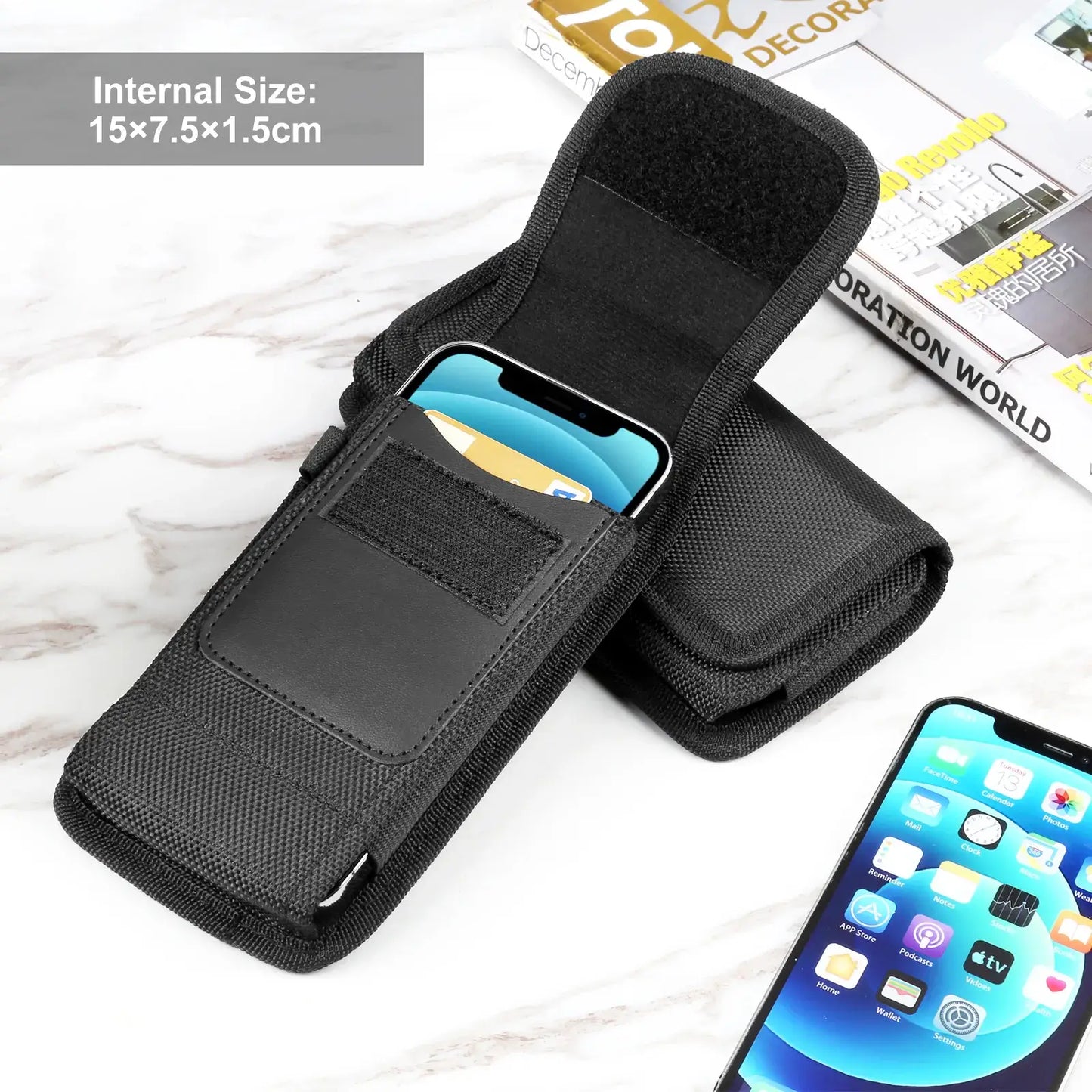 Black phone holster with a smartphone inside on a wooden surface, with a magazine in the background