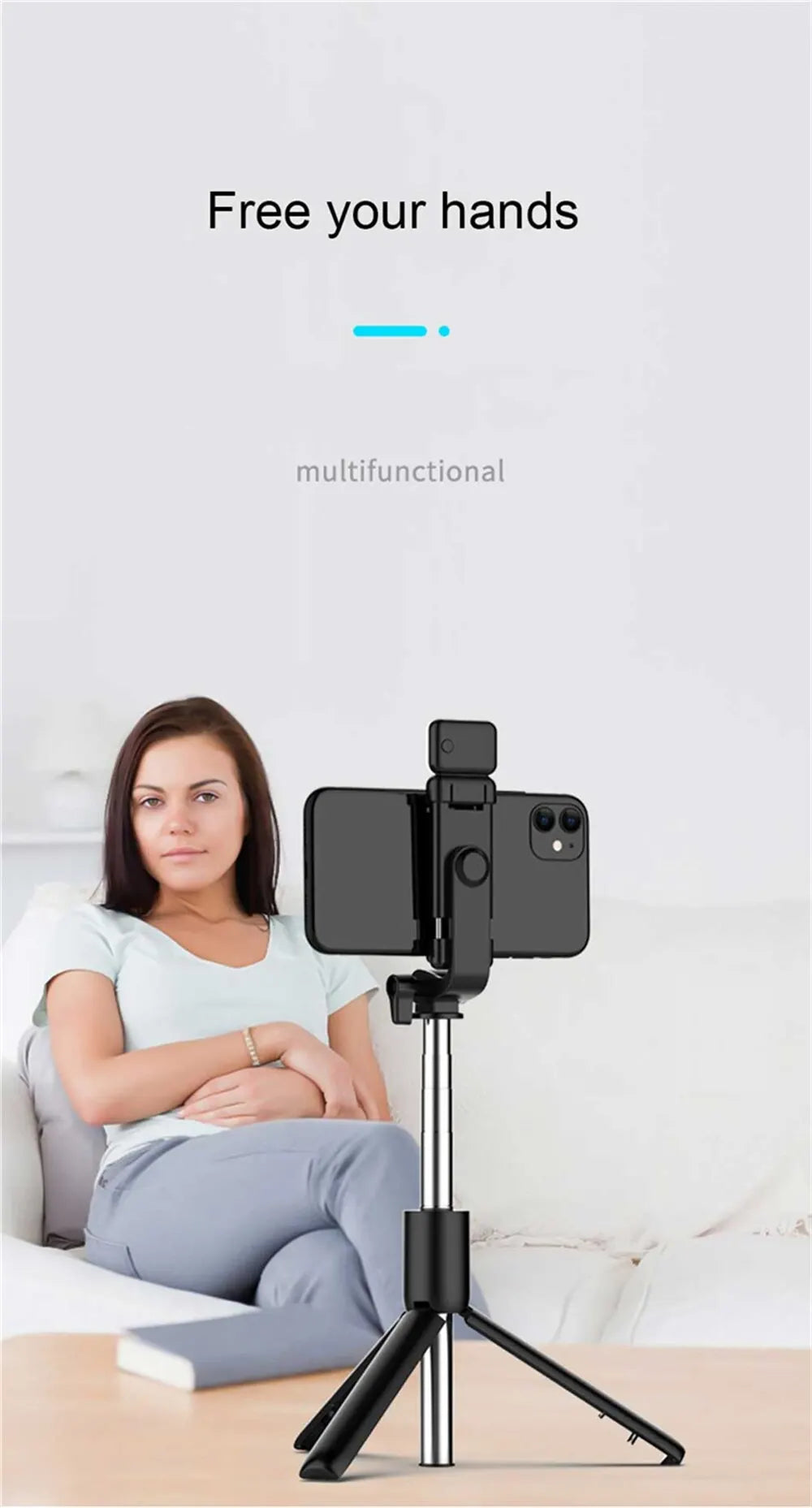 Woman using a smartphone holder with a tripod on a light-colored surface.