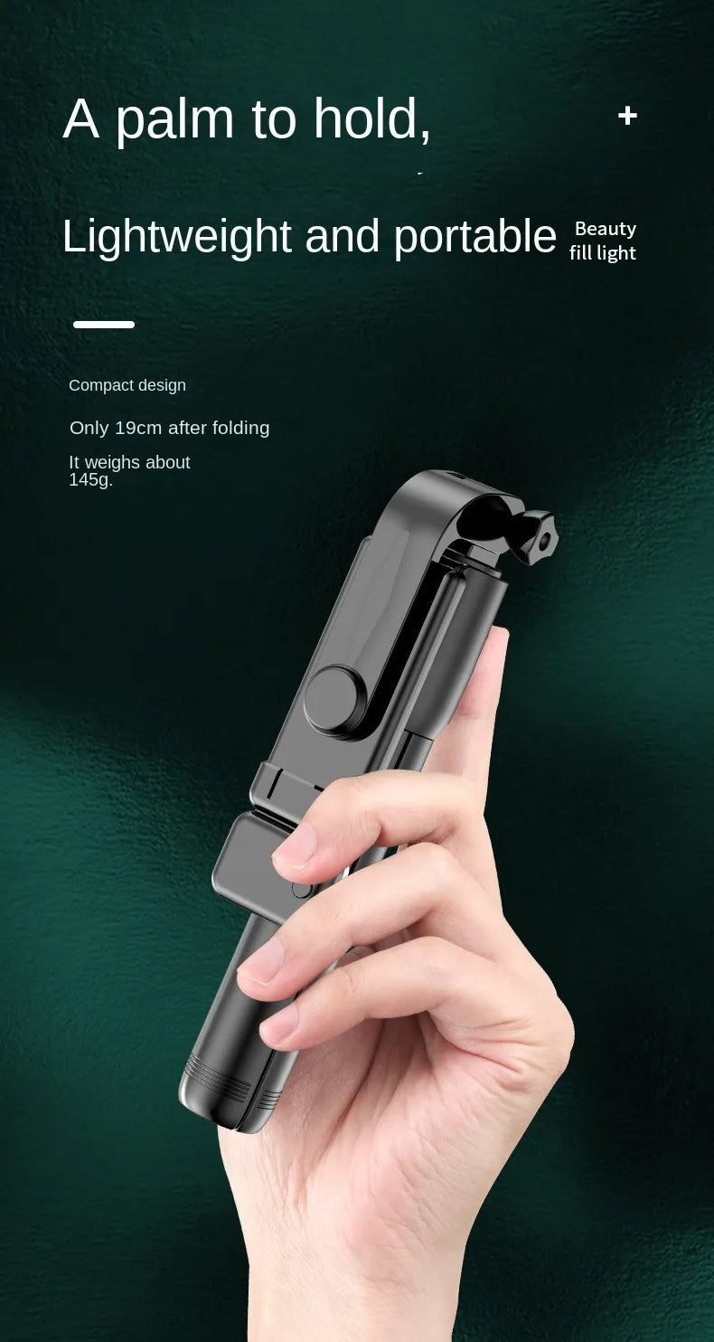 Hand holding a compact beauty fill light with text on a dark background