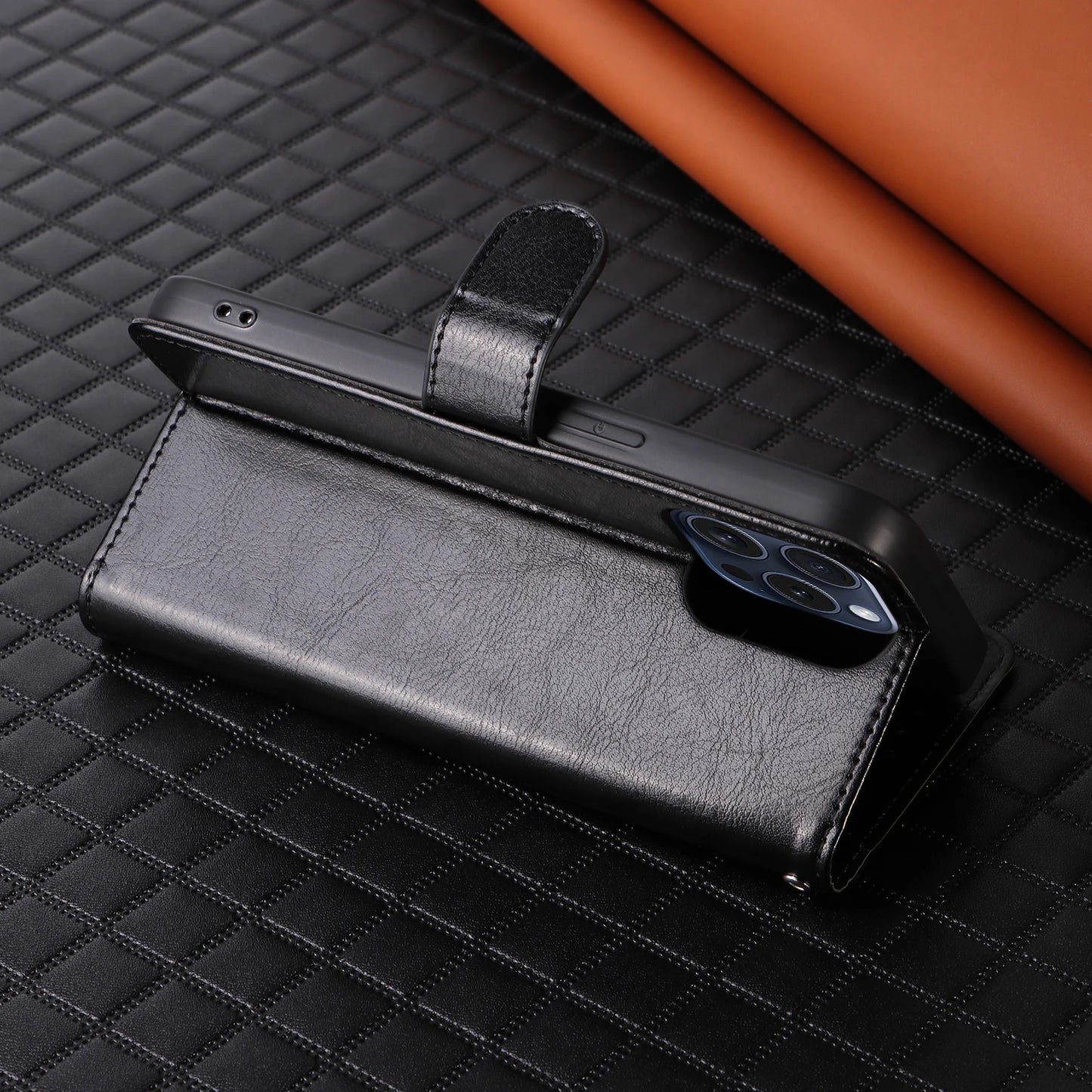 Black phone case with a phone inside on a textured surface