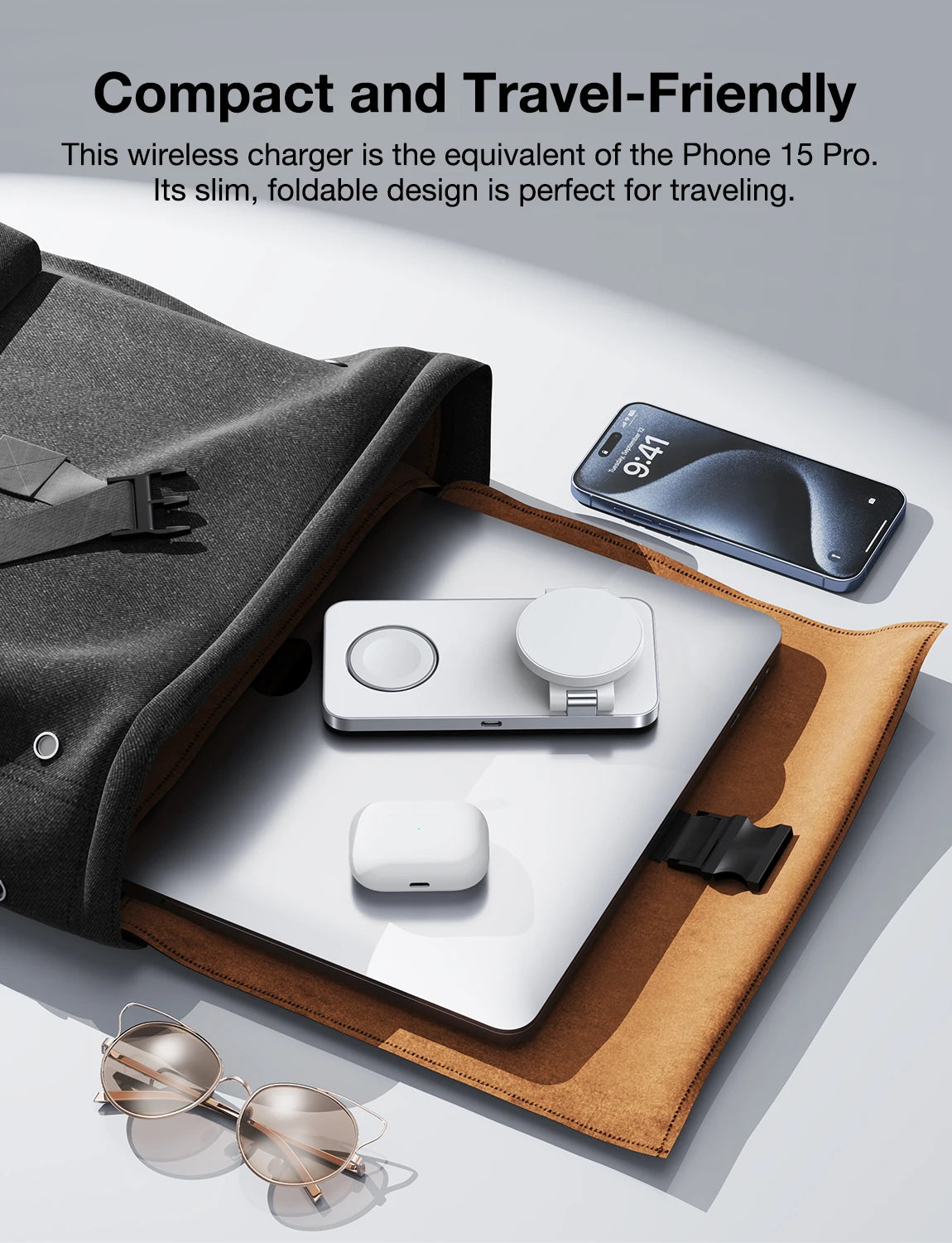 Wireless charger with phone and accessories on a light surface