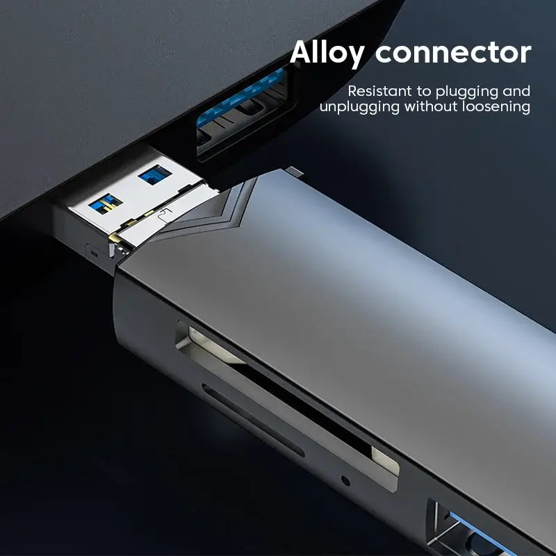 Close-up of a laptop with USB ports and an alloy connector labeled "Resistant to plugging and unplugging without loosening"