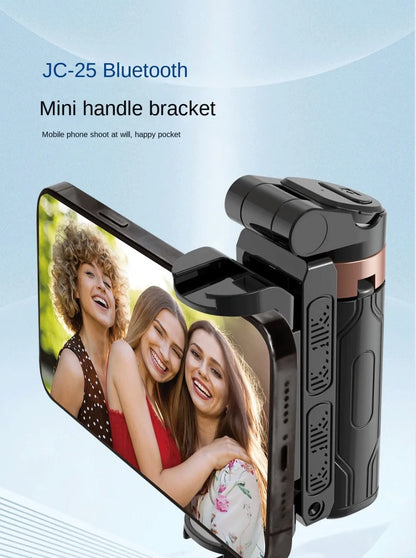 JC-25 Bluetooth mini handle bracket with a phone attached, showing a photo of three women on the screen.