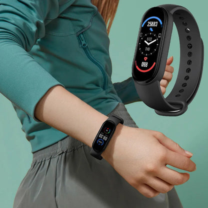 Person wearing a smartwatch with a close-up of the watch face on a teal background