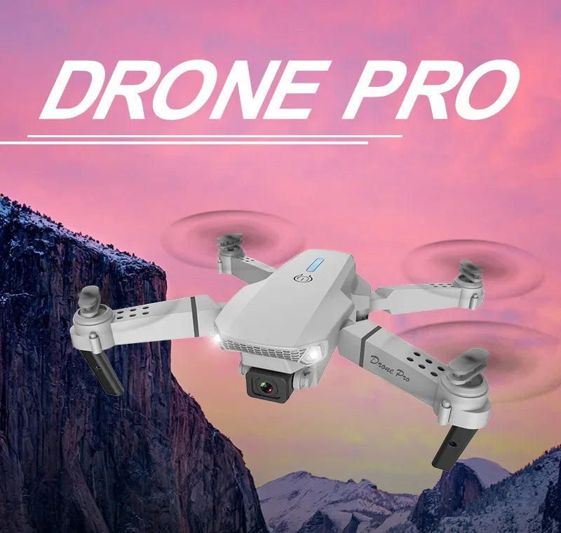 White drone with 'DRONE PRO' text against a mountainous landscape background