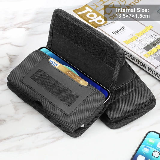 Black phone holster with built-in card holder on a white surface

