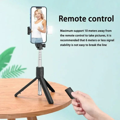 Phone holder with remote control on a table, with text about remote control functionality.