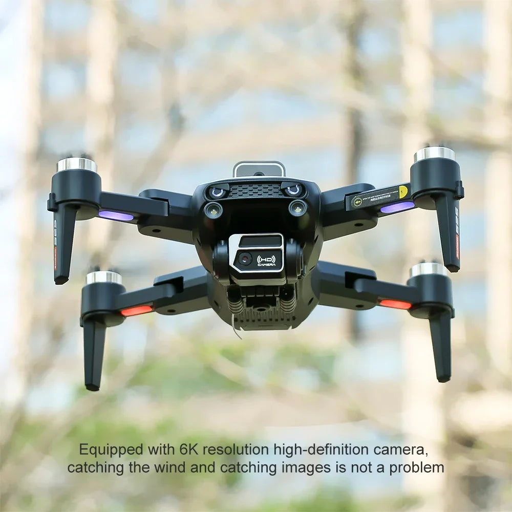 Black drone with camera in flight against a blurred natural background
