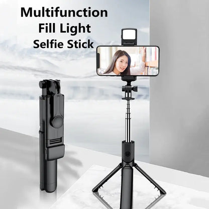 Multifunctional fill light selfie stick with smartphone on a stand
