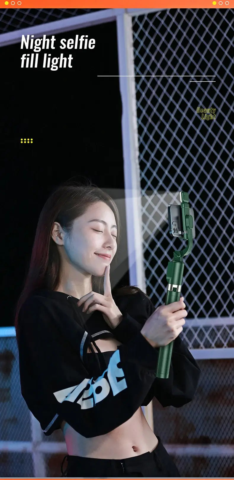 Person holding a selfie stick with night selfie fill light feature displayed.