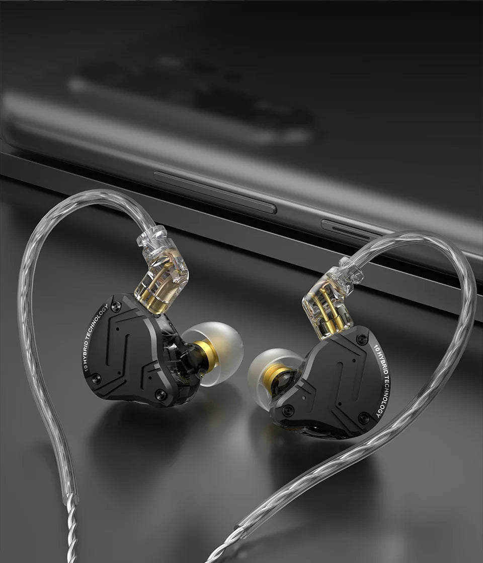 In-ear headphones with clear cable on a dark surface