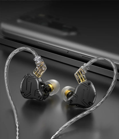 In-ear headphones with clear cable on a dark surface
