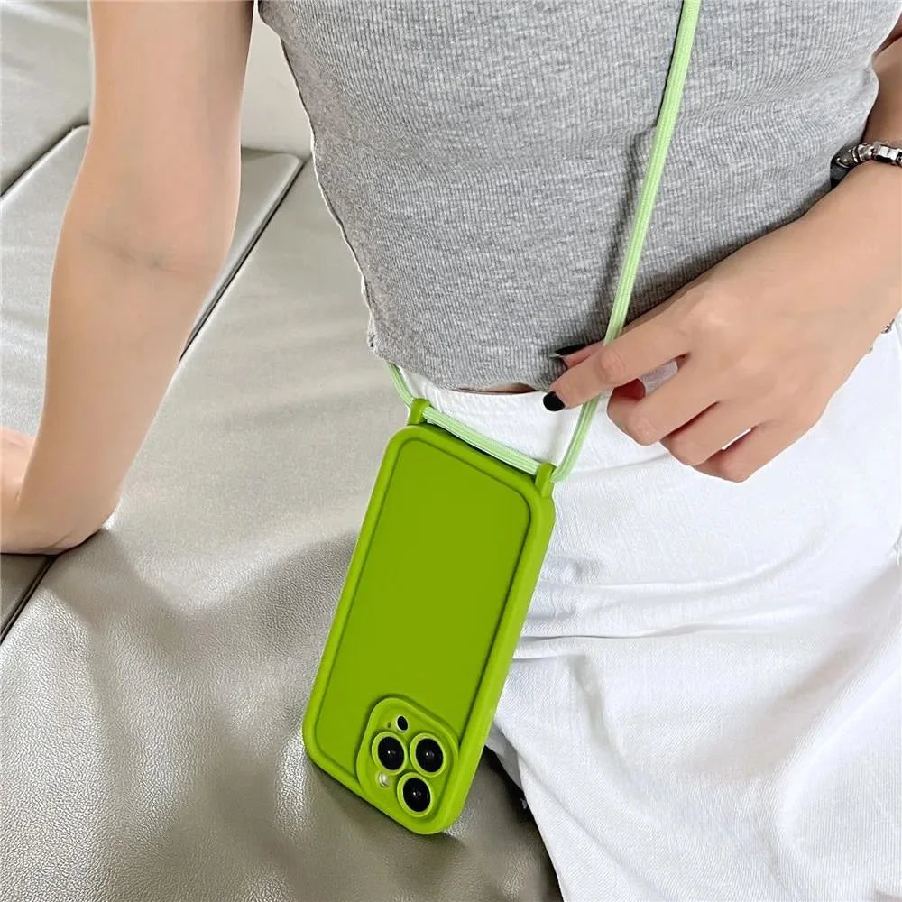 Person holding a lime green phone case with a strap
