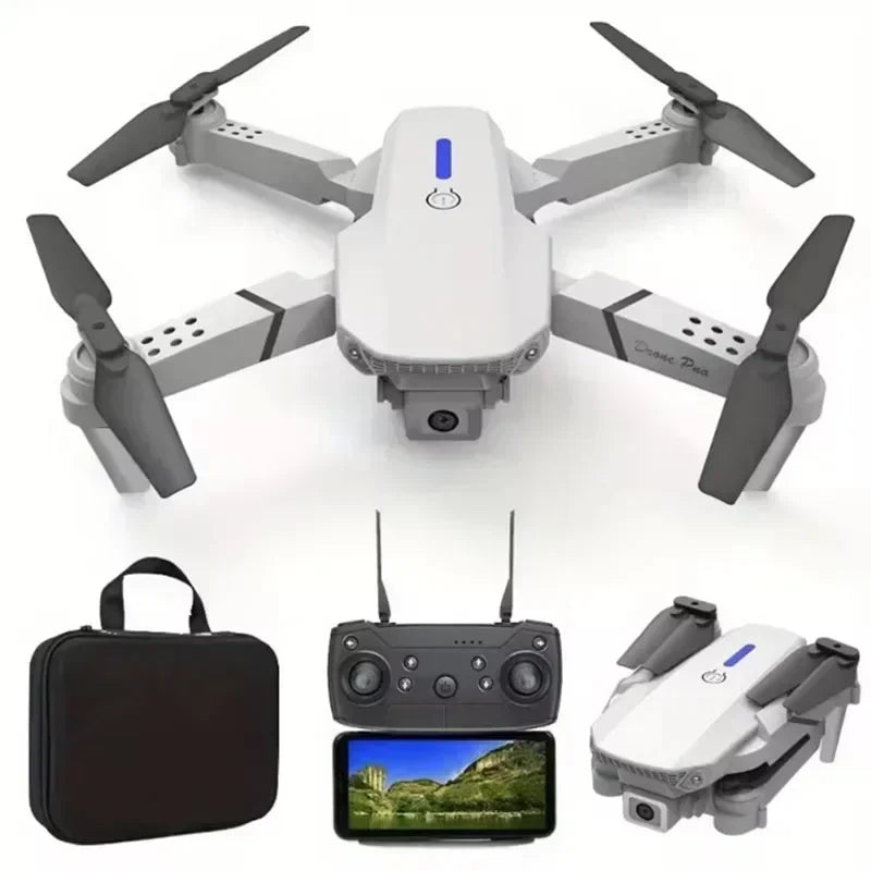White drone with black propellers, carrying case, remote control, and screen displaying a landscape.