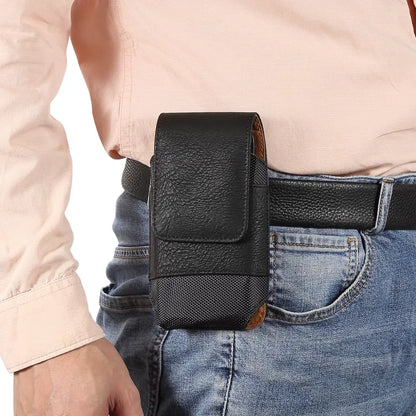 Person wearing a black leather phone holster on a belt
