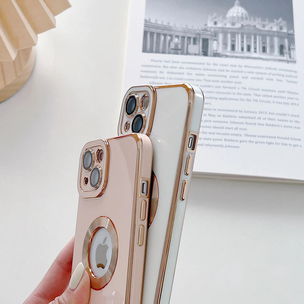 Rose gold phone case with Apple logo held by a hand on a light background